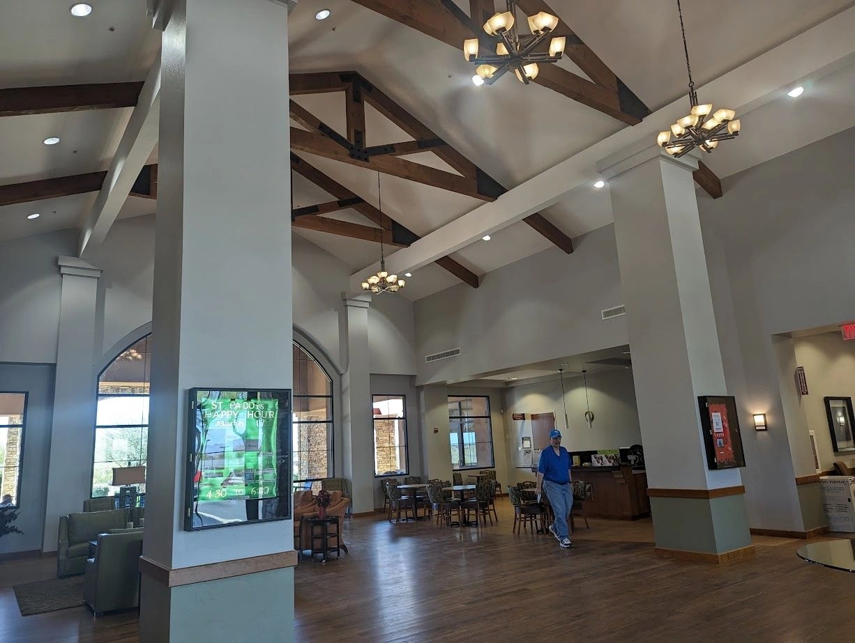 Modern interior with exposed wooden beams and warm lighting